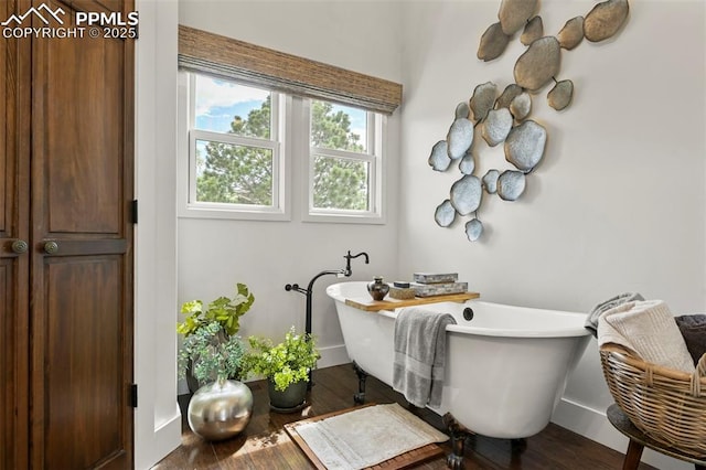 3320 Camels Ridge Ln, Colorado Springs, CO 80904 - bathroom with hardwood / wood-style floors and a freestanding bath