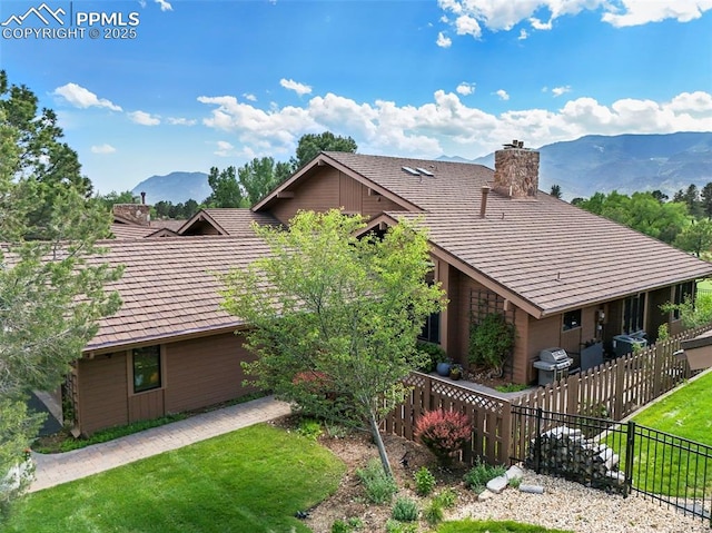 3320 Camels Ridge Ln, Colorado Springs, CO 80904 - view of side of property featuring a chimney and a mountain view
