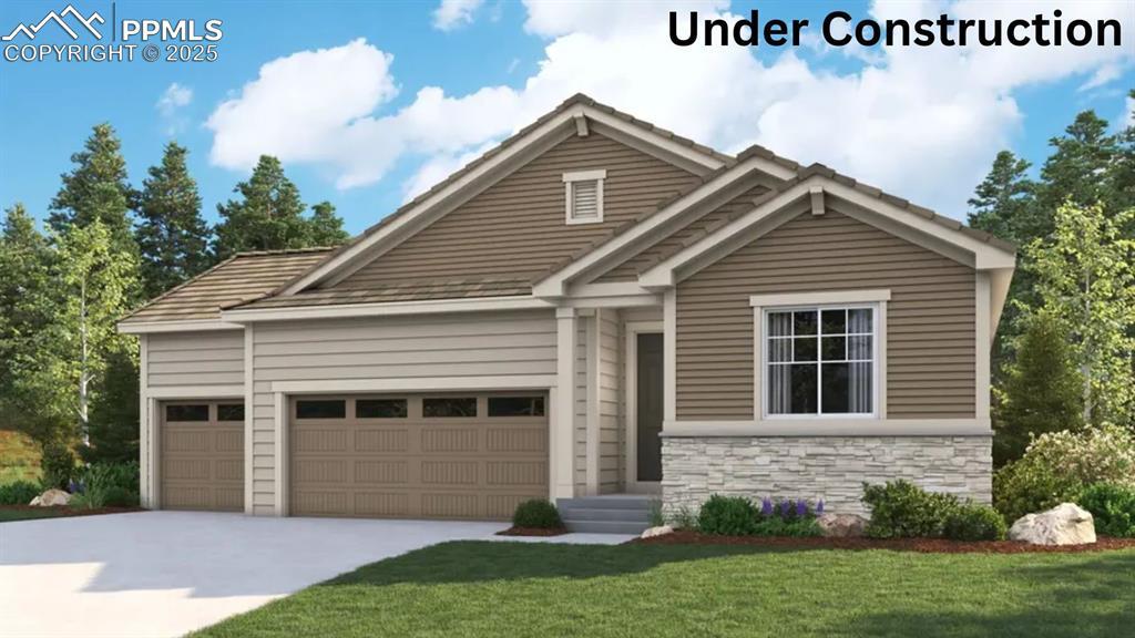 16911 Starfall Dr, Monument, CO 80132 - view of front of house featuring an attached garage, stone siding, driveway, and a front lawn