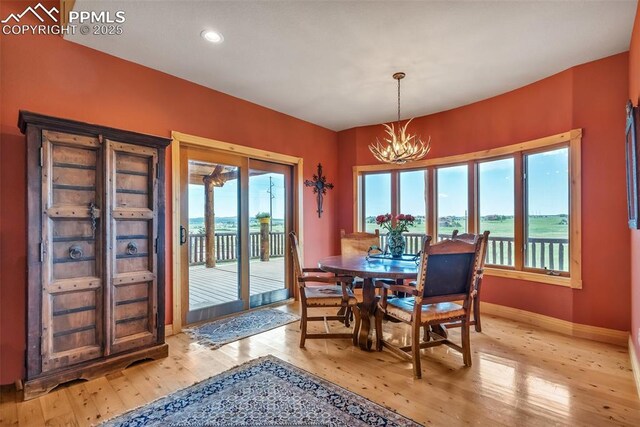 15958 Shadow Mountain Ranch Rd, Larkspur, CO 80118 - dining space featuring a chandelier, light wood-style floors, baseboards, and recessed lighting