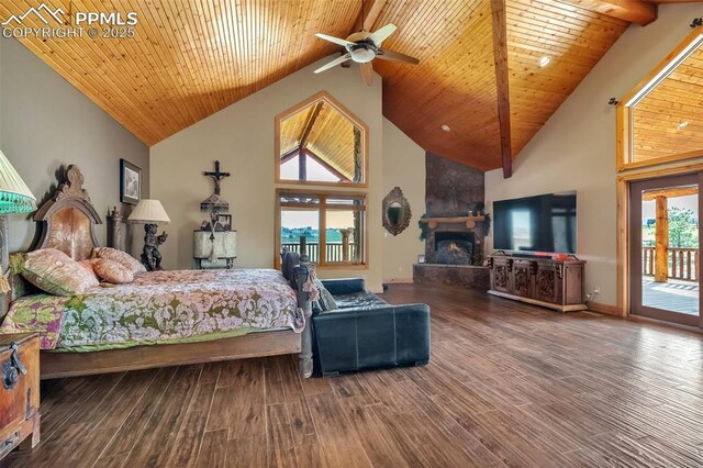 15958 Shadow Mountain Ranch Rd, Larkspur, CO 80118 - bedroom featuring high vaulted ceiling, access to outside, a large fireplace, wooden ceiling with exposed beams, and wood finished floors