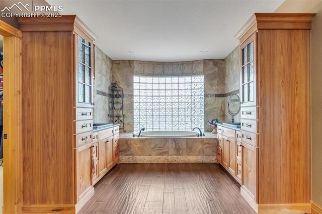 15958 Shadow Mountain Ranch Rd, Larkspur, CO 80118 - bathroom featuring vanity, hardwood / wood-style floors, and a bath