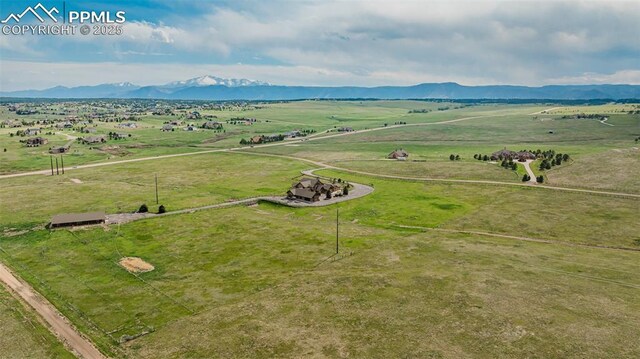 15958 Shadow Mountain Ranch Rd, Larkspur, CO 80118 - aerial view of sparsely populated area featuring a mountain backdrop and a pastoral area