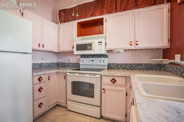 6430 Chantilly Pl, Colorado Springs, CO 80922 - kitchen featuring white appliances, light countertops, and white cabinetry