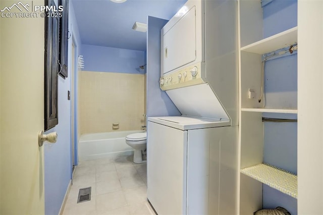 6430 Chantilly Pl, Colorado Springs, CO 80922 - laundry room with estacked washer and dryer and light tile patterned flooring