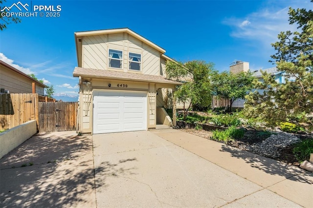 6430 Chantilly Pl, Colorado Springs, CO 80922 - view of home's exterior with a garage, concrete driveway, and a gate