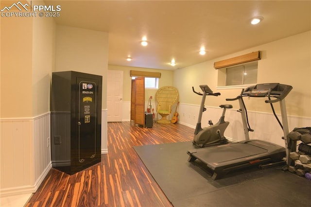 2525 Snowbird Ct, Colorado Springs, CO 80918 - workout room with dark wood finished floors, baseboards, and a wainscoted wall