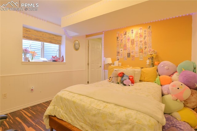 2525 Snowbird Ct, Colorado Springs, CO 80918 - bedroom with wood finished floors and a wainscoted wall