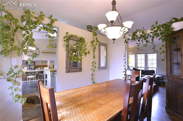 2525 Snowbird Ct, Colorado Springs, CO 80918 - dining space featuring a chandelier and dark wood-type flooring