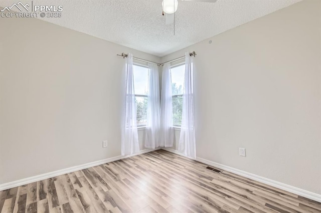 9412 Dew Drop Ct, Colorado Springs, CO 80925 - spare room featuring wood finished floors, a textured ceiling, baseboards, and ceiling fan