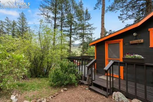 6015 Sioux Trl, Cascade, CO 80809 - view of home's exterior featuring a wooden deck