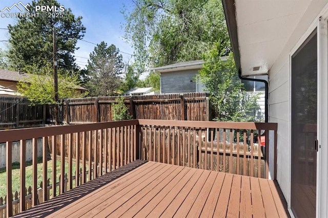527 W Columbia St, Colorado Springs, CO 80907 - wooden terrace with a fenced backyard
