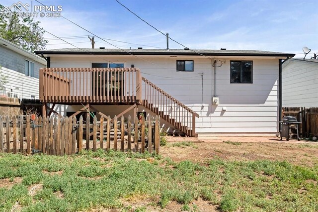 527 W Columbia St, Colorado Springs, CO 80907 - rear view of property with a wooden deck and stairway