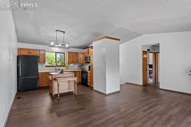 527 W Columbia St, Colorado Springs, CO 80907 - kitchen featuring black appliances, dark wood finished floors, a textured ceiling, a sink, and baseboards