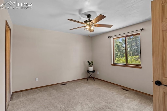 527 W Columbia St, Colorado Springs, CO 80907 - unfurnished room with light carpet, ceiling fan, and baseboards