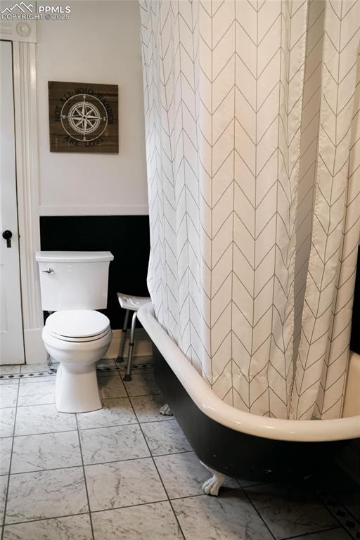 817 Swope Ave, Colorado Springs, CO 80909 - full bathroom featuring toilet and shower / bath combo