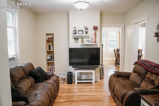 817 Swope Ave, Colorado Springs, CO 80909 - living room featuring light wood-type flooring and cooling unit