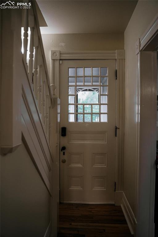 817 Swope Ave, Colorado Springs, CO 80909 - doorway to outside featuring stairway and wood finished floors