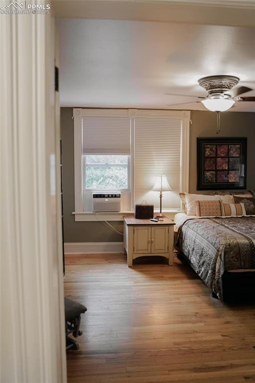 817 Swope Ave, Colorado Springs, CO 80909 - bedroom featuring light wood finished floors and cooling unit