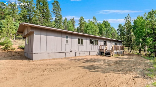 900 Beaver Creek Dr, Florissant, CO 80816 - rear view of property with a wooden deck and board and batten siding