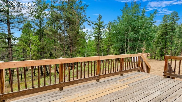 900 Beaver Creek Dr, Florissant, CO 80816 - wooden terrace with a forest view