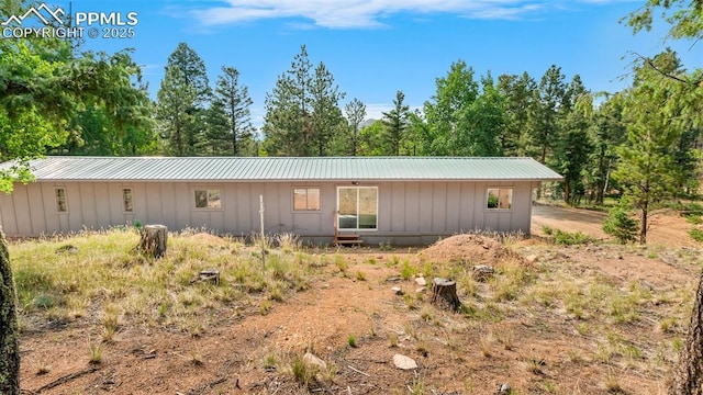 900 Beaver Creek Dr, Florissant, CO 80816 - view of side of property with board and batten siding and metal roof