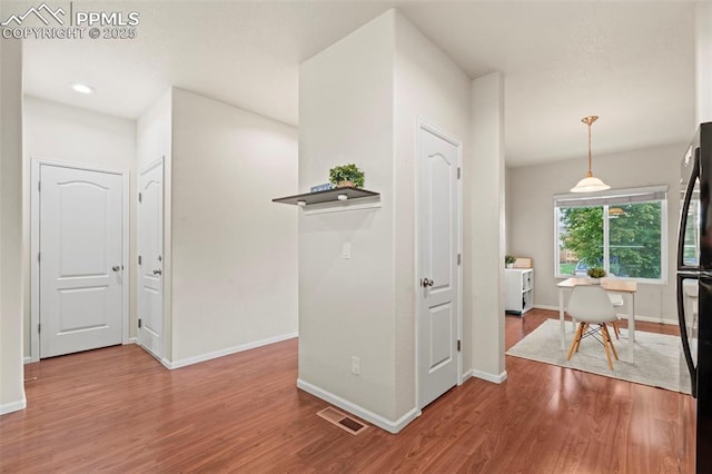 10067 Seawolf Dr, Colorado Springs, CO 80925 - corridor featuring wood finished floors, baseboards, and recessed lighting