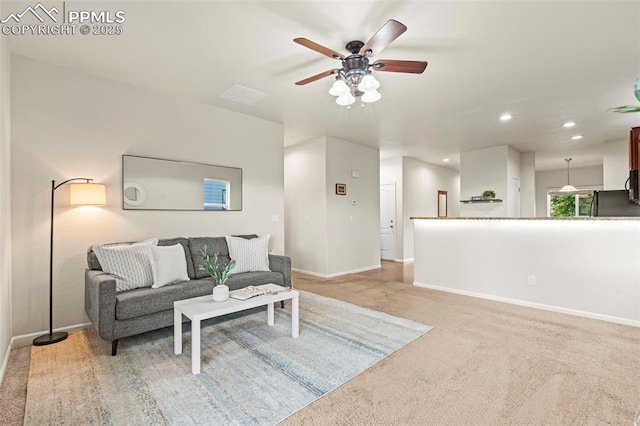 10067 Seawolf Dr, Colorado Springs, CO 80925 - living area with baseboards, a ceiling fan, recessed lighting, and light colored carpet