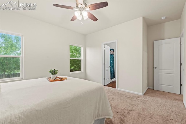 10067 Seawolf Dr, Colorado Springs, CO 80925 - carpeted bedroom with multiple windows, baseboards, and ceiling fan