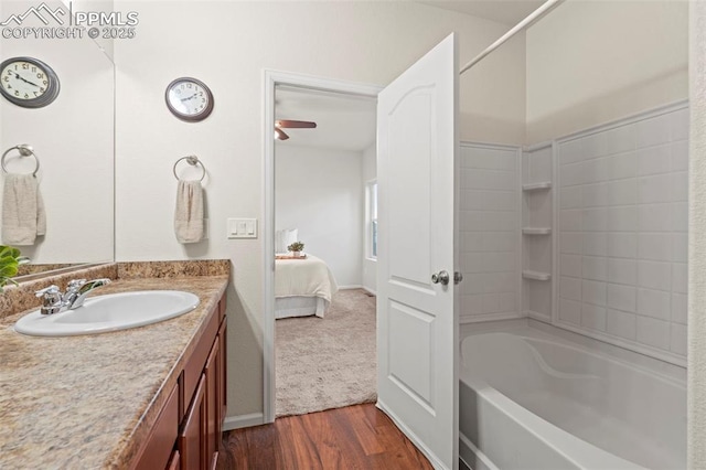 10067 Seawolf Dr, Colorado Springs, CO 80925 - full bath with vanity, bathing tub / shower combination, wood finished floors, ensuite bathroom, and a ceiling fan