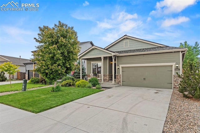 10067 Seawolf Dr, Colorado Springs, CO 80925 - view of front of property featuring a porch, a front yard, a garage, driveway, and stone siding