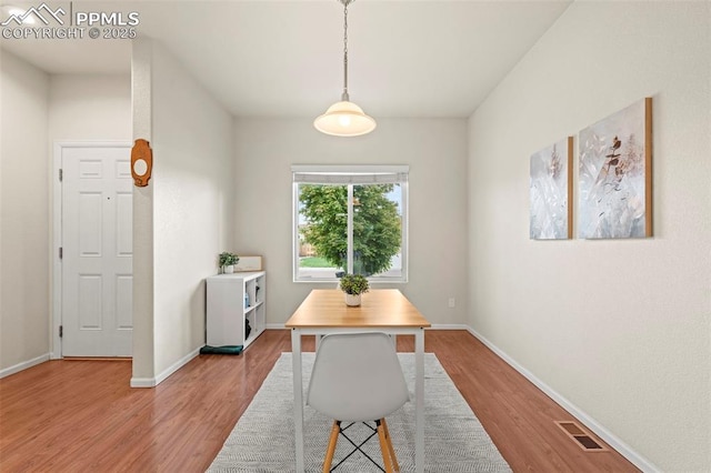 10067 Seawolf Dr, Colorado Springs, CO 80925 - dining space with light wood-type flooring and baseboards