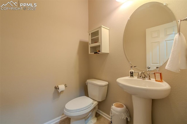 7312 Grady Cir, Castle Rock, CO 80108 - bathroom featuring toilet, a sink, and baseboards