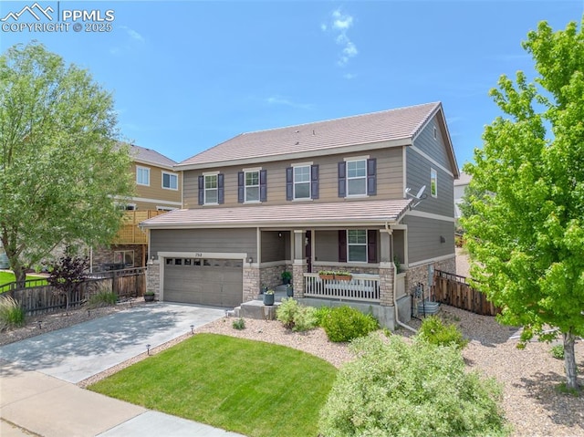 7312 Grady Cir, Castle Rock, CO 80108 - craftsman-style house with covered porch, stone siding, an attached garage, concrete driveway, and a tile roof