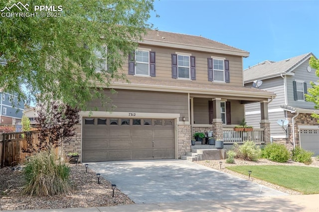 7312 Grady Cir, Castle Rock, CO 80108 - view of front facade with a porch, an attached garage, driveway, and stone siding