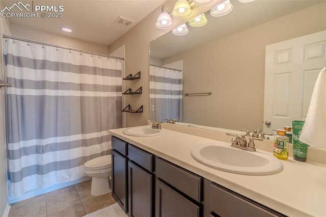 7312 Grady Cir, Castle Rock, CO 80108 - full bathroom with tile patterned floors, toilet, double vanity, and a shower with shower curtain