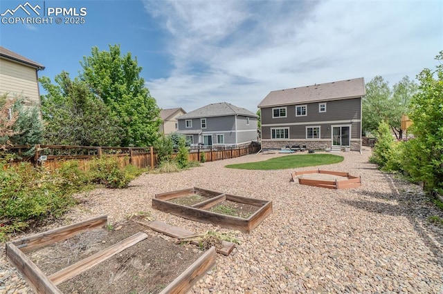 7312 Grady Cir, Castle Rock, CO 80108 - fenced yard with a garden and a patio area