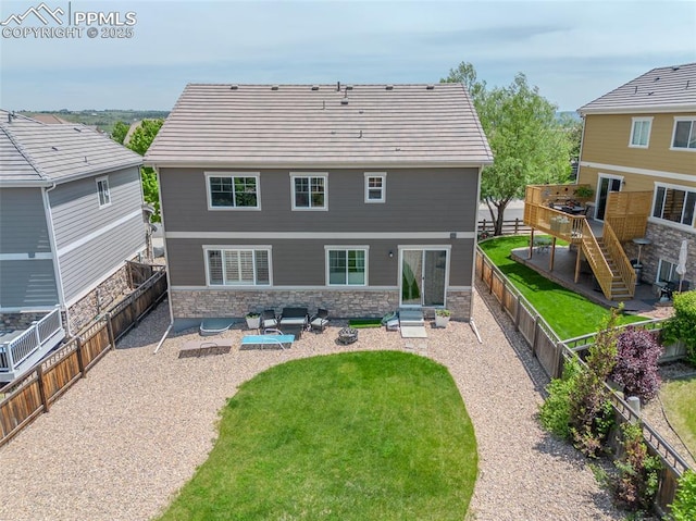 7312 Grady Cir, Castle Rock, CO 80108 - back of house featuring stone siding, stairway, a wooden deck, and a patio