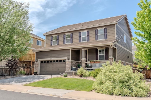 7312 Grady Cir, Castle Rock, CO 80108 - view of front of house featuring a porch, an attached garage, concrete driveway, and stone siding