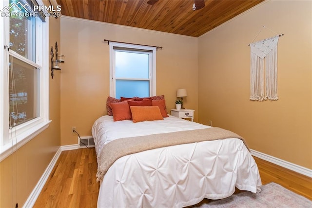 1017 N Sheridan Ave, Colorado Springs, CO 80909 - bedroom featuring wood ceiling, wood finished floors, baseboards, and crown molding