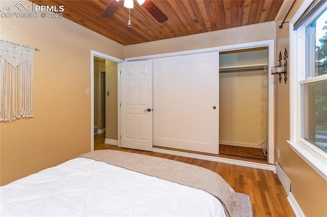 1017 N Sheridan Ave, Colorado Springs, CO 80909 - bedroom featuring wood ceiling, wood finished floors, a closet, and baseboards