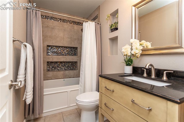 1017 N Sheridan Ave, Colorado Springs, CO 80909 - full bath featuring vanity, toilet, shower / tub combo with curtain, and tile patterned flooring