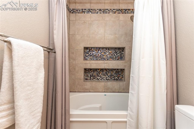 1017 N Sheridan Ave, Colorado Springs, CO 80909 - full bathroom featuring shower / bath combination with curtain, toilet, and a textured wall