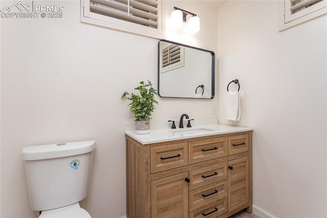 1017 N Sheridan Ave, Colorado Springs, CO 80909 - bathroom with vanity, toilet, and baseboards