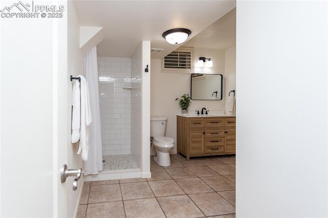 1017 N Sheridan Ave, Colorado Springs, CO 80909 - bathroom featuring vanity, toilet, tile patterned floors, and a shower stall