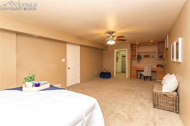 1017 N Sheridan Ave, Colorado Springs, CO 80909 - bedroom featuring a desk, carpet, ceiling fan, and a spacious closet
