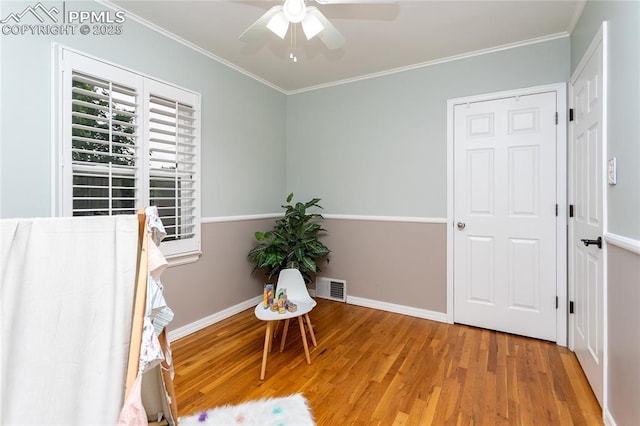 1017 N Sheridan Ave, Colorado Springs, CO 80909 - unfurnished room with wood finished floors, crown molding, a ceiling fan, and baseboards