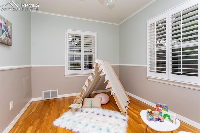 1017 N Sheridan Ave, Colorado Springs, CO 80909 - playroom featuring wood finished floors, ornamental molding, and baseboards