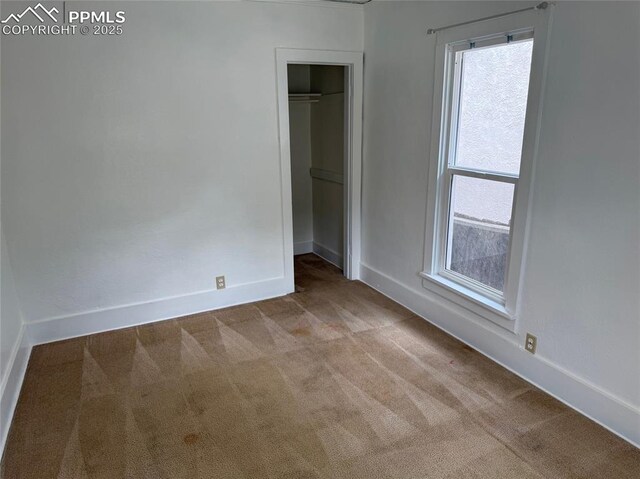 506 S Hancock Ave, Colorado Springs, CO 80903 - unfurnished bedroom with carpet, baseboards, and a closet