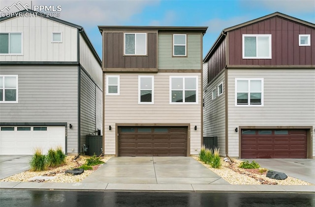 6697 Cool Breeze Dr, Colorado Springs, CO 80923 - view of front of property featuring board and batten siding, a garage, and concrete driveway